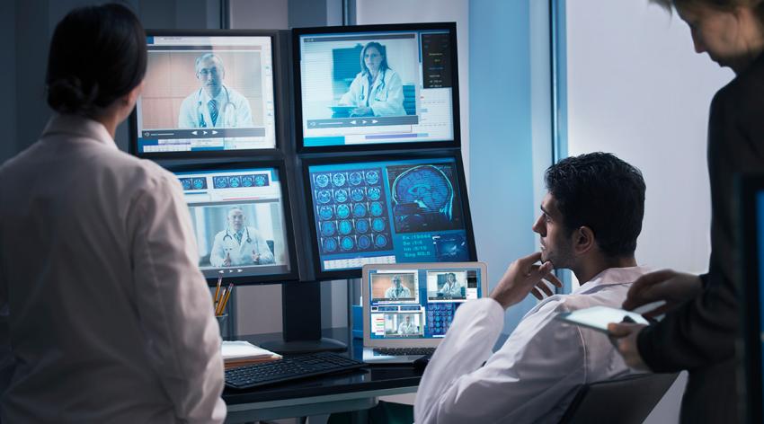 Doctors examining x-rays in video conference